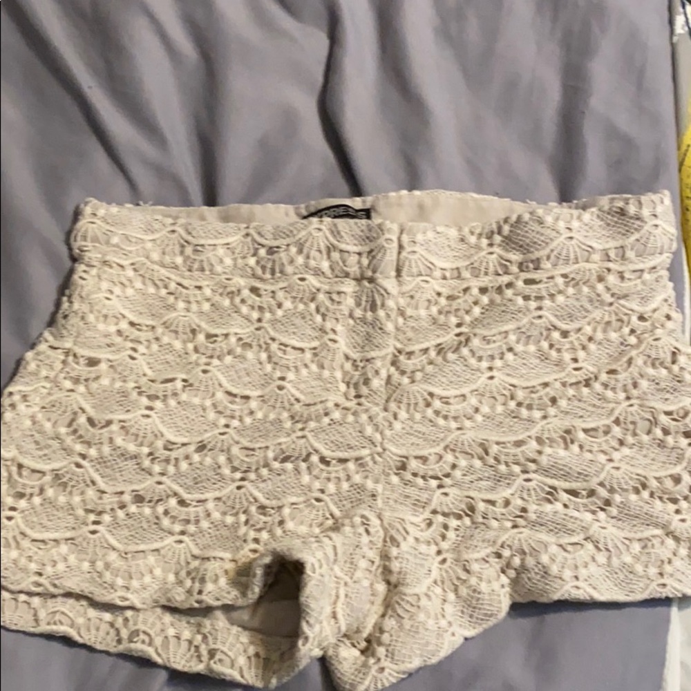 Lacy, cream colored shorts.